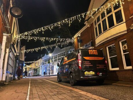 Matheson Electrical branded van parked under Christmas Lights on Woodbridge Thoroughfare