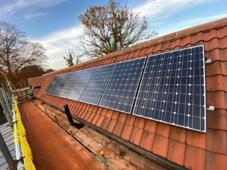 Solar panels on a red tiled roof